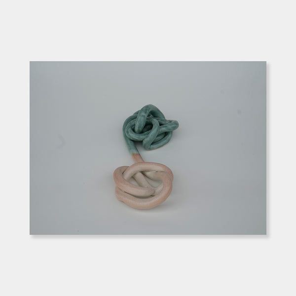 Artsuite - Sangsun Bae - Ribbon 3 - Sculpture - Ceramic -11" x 6" x 3"- Bae expresses herself through soft and graceful lines and interlocking curves. By using organic forms, her work has a flowing elegance demonstrating complete abstraction. This basic element in her work reflects the stoic style of expression that invokes ties to Buddhism.  Edit alt text
