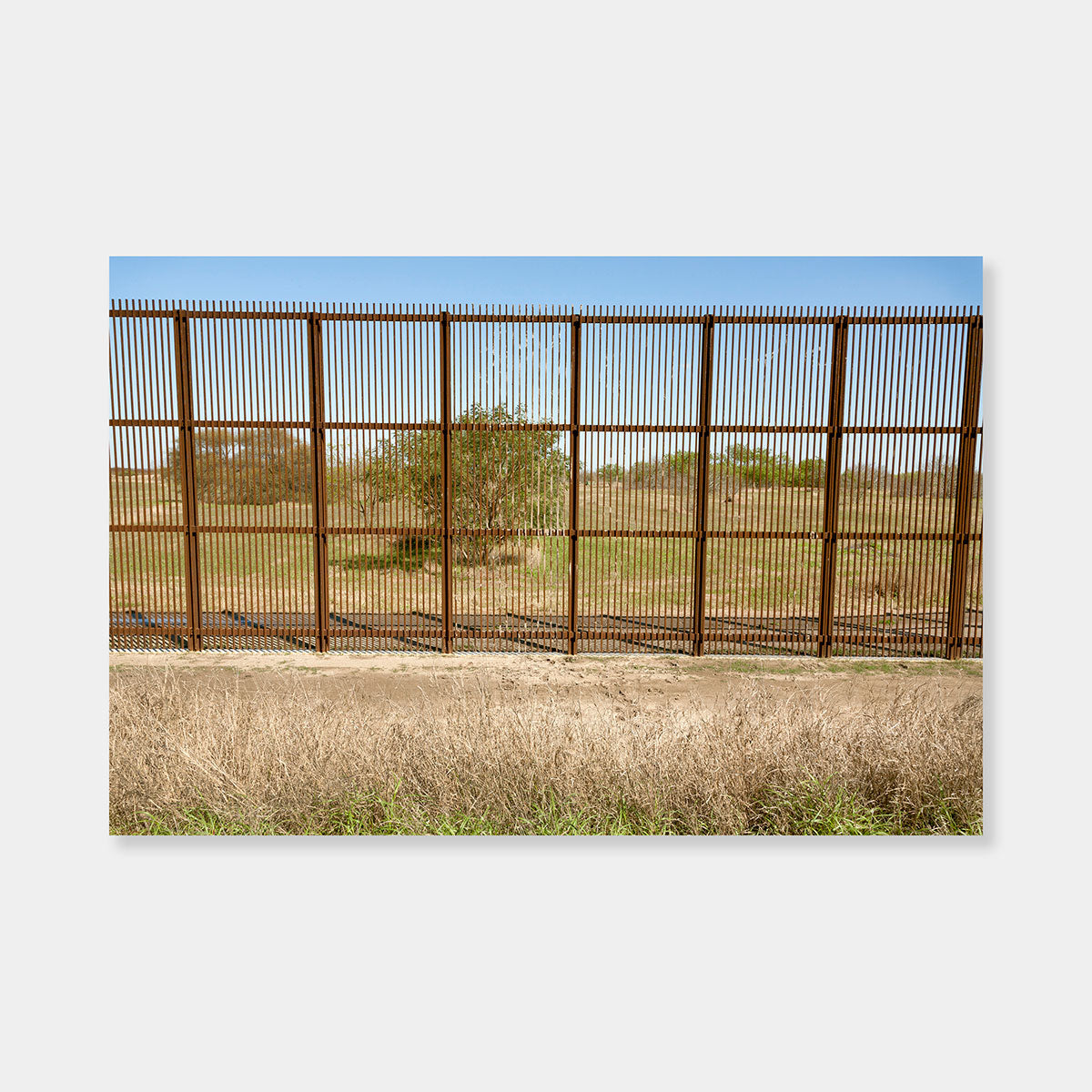 Artsuite - Susan Harbage Page - Border Fence - Photography - Edition 2 of 5 - 44" x 60" - Border Works - The eleven year U.S.–Mexico Border Project touches on many topics including gender, immigration, and migration, and rethinks the ways in which we look at diversity, identity, and difference.  Border Fence with muddy footprints.