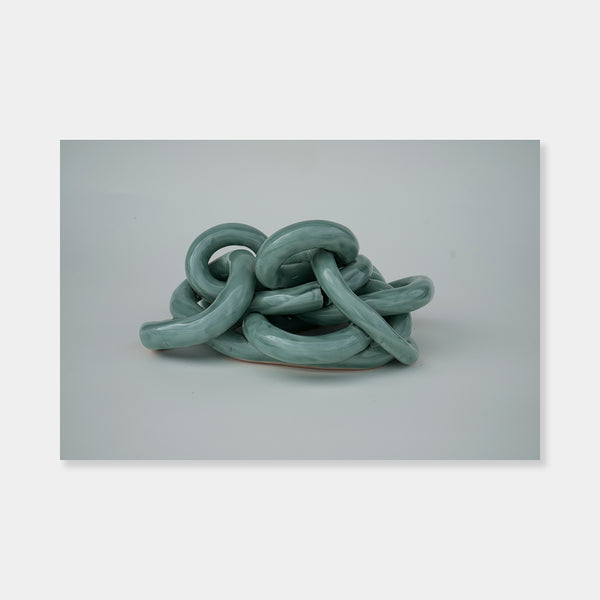 Artsuite - Sangsun Bae - Gordian Knot 2 - Sculpture - Ceramic - 8" x 7" x 4"- Bae expresses herself through soft and graceful lines and interlocking curves.  By using organic forms, her work has a flowing elegance demonstrating complete abstraction.  This basic element in her work reflects the stoic style of expression that invokes ties to Buddhism.