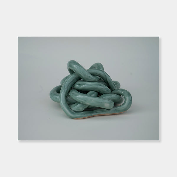 Artsuite - Sangsun Bae - Gordian Knot 2 - Sculpture - Ceramic - 8" x 7" x 4"- Bae expresses herself through soft and graceful lines and interlocking curves.  By using organic forms, her work has a flowing elegance demonstrating complete abstraction.  This basic element in her work reflects the stoic style of expression that invokes ties to Buddhism.