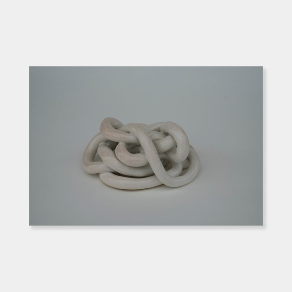 Artsuite - Sangsun Bae - Gordian Knot 3 - Sculpture - Ceramic - 8" x 7" x 4"- Bae expresses herself through soft and graceful lines and interlocking curves.  By using organic forms, her work has a flowing elegance demonstrating complete abstraction.  This basic element in her work reflects the stoic style of expression that invokes ties to Buddhism.