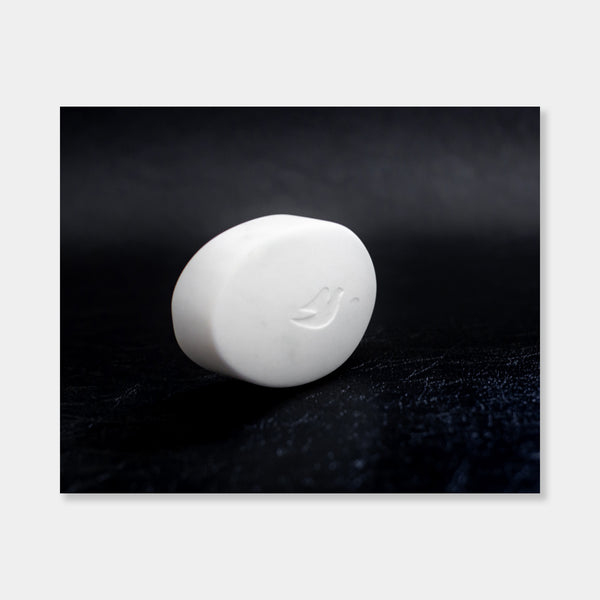Artsuite - Peter Oakley - Dove Soap - Original sculpture out of marble.  Oakley developed his carving skills working as a stonemason, making grave markers and memorials before turning to sculpture. In his hand, the marble sculpture becomes a solid ghost of what it represents—full of physical presence, but missing the functionality of the object.